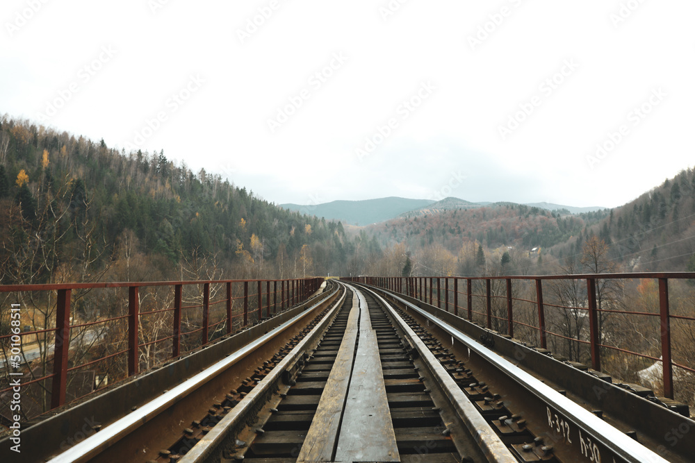 Concept of travel and adventure, railroad in mountains
