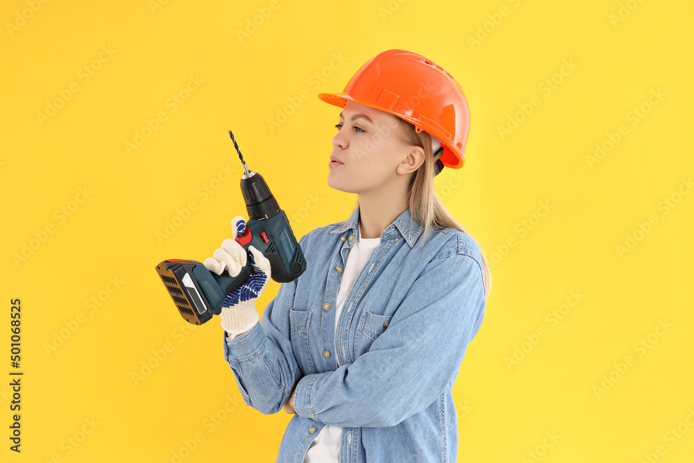 Concept of occupation, young woman on yellow background Concept of occupation, young woman on yellow background