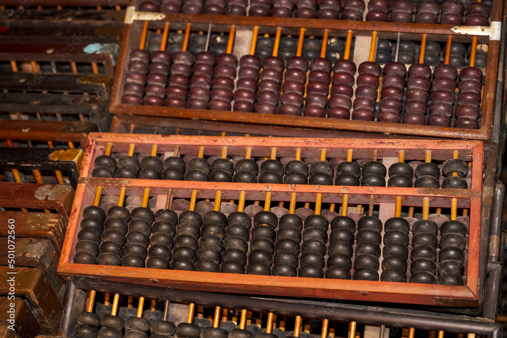 Pile of traditional retro Chinese wooden abacus close-up Pile of traditional retro Chinese wooden abacus close-up