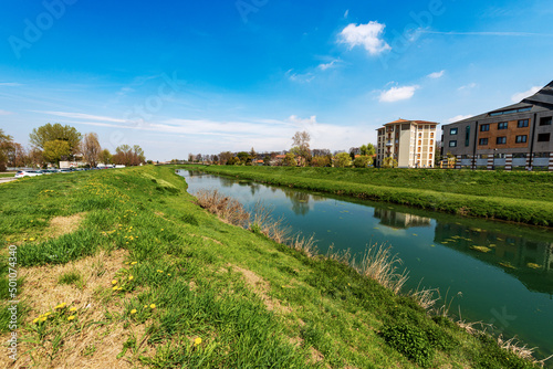 The River Monticano with the green banks in springtime, small town of Oderzo, Treviso province, Veneto, Italy, Europe.