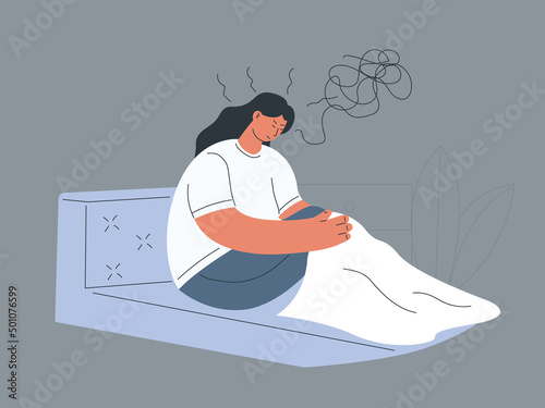 Sad woman staying in bed in her bedroom waking up with migraine or suffering from insomnia