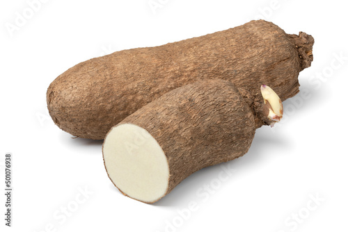  Whole and halved raw African yam isolated on white background photo