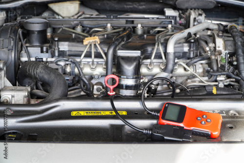 Vehicle Maintenance Auto Service Diagnostic Tool.Car Computer Error Reading Using Mobile Device.
 photo