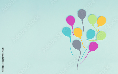 Colorful ballons on a blue colored background, children birthday greeting card, happy holiday, copy space for text