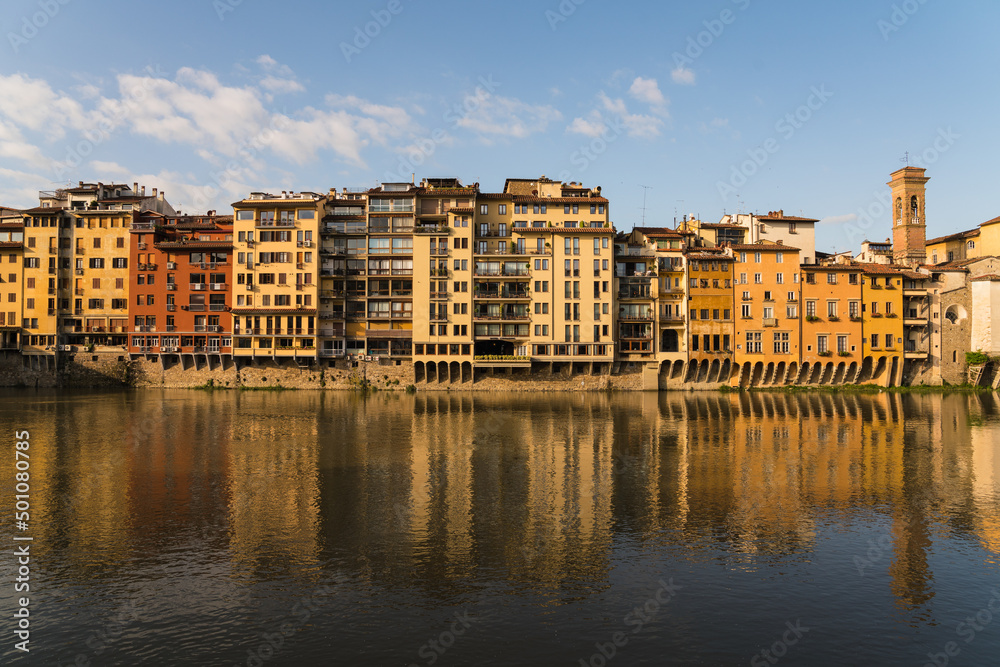Naklejka premium buildings along the Arno river and morning sunshine 