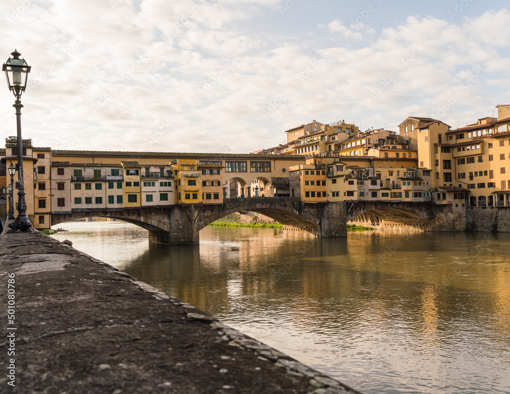 view of the Ponte Vecchio in Florence, Italy and the Arno river
