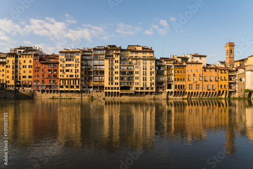 buildings along the Arno river and morning sunshine 