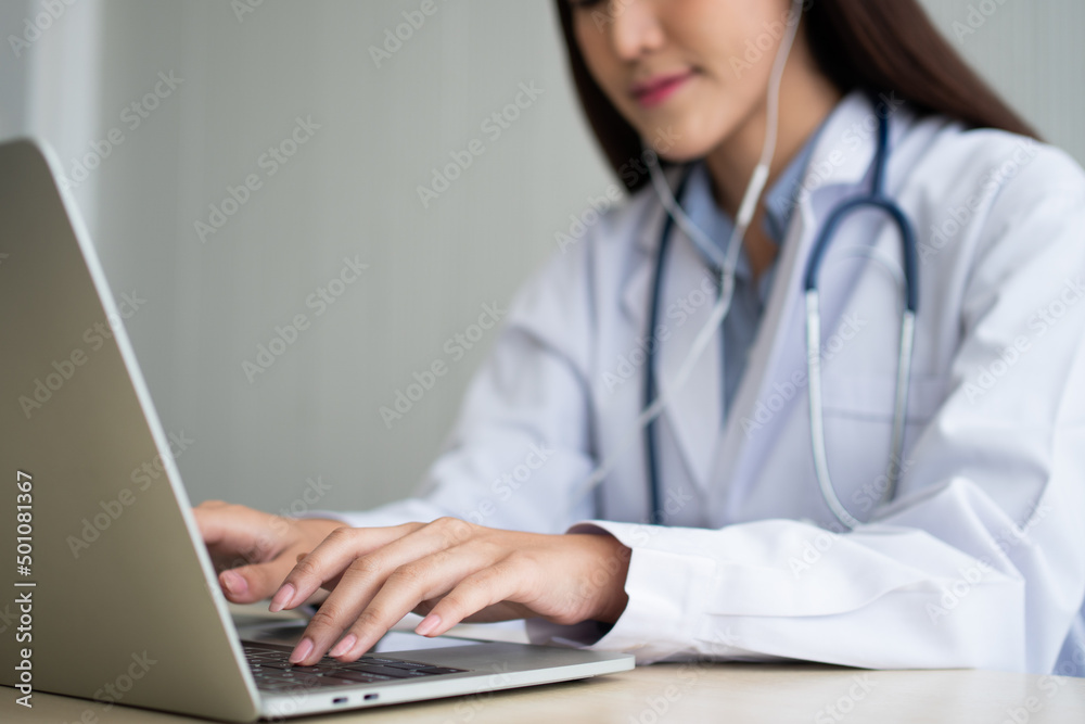 Asian woman doctor is online visiting with a patient on the internet application and Listening of the symptoms and explains how to treat the initial disease, Concept of Medical technology. Asian woman doctor is online visiting with a patient on the internet application and Listening of the symptoms and explains how to treat the initial disease, Concept of Medical technology.