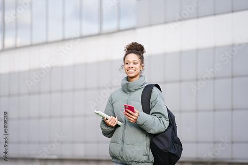 Portrait African american teenage student girl happy going to college or school 