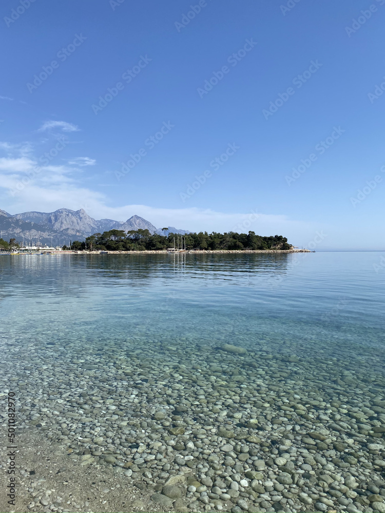 The coast of Mediterranean sea in Kemer, seaside resort and district of Antalya Province on the Mediterranean coast of Turkey The coast of Mediterranean sea in Kemer, seaside resort and district of Antalya Province on the Mediterranean coast of Turkey