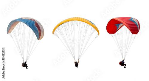 collection Bright colorful parachute isolated on white background, The sportsman flying on a paraglider. Concept of extreme sport, taking adventure challenge.