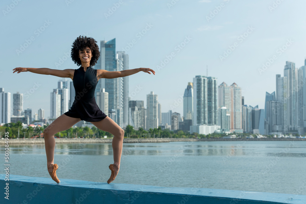 Front view of latin ballet dancer practicing on street in Panama city, Central America Front view of latin ballet dancer practicing on street in Panama city, Central America