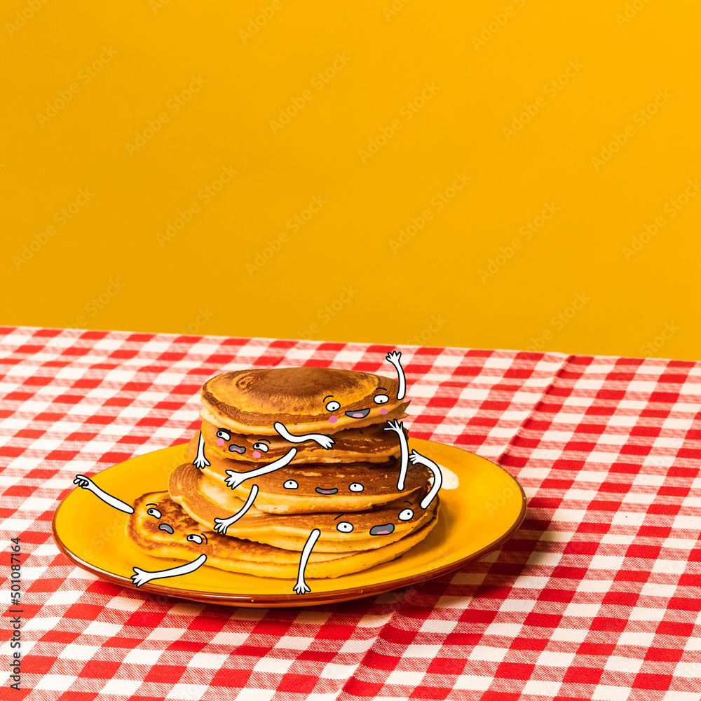 Food pop art photography. Plate with pancakes with funny drawings on plaid  tablecloth isolated on bright yellow background. Cartoon, vintage, retro  style Photos | Adobe Stock
