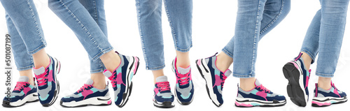 Sneakers on the legs on a white isolated background. Side view from front to back. Shoe display example