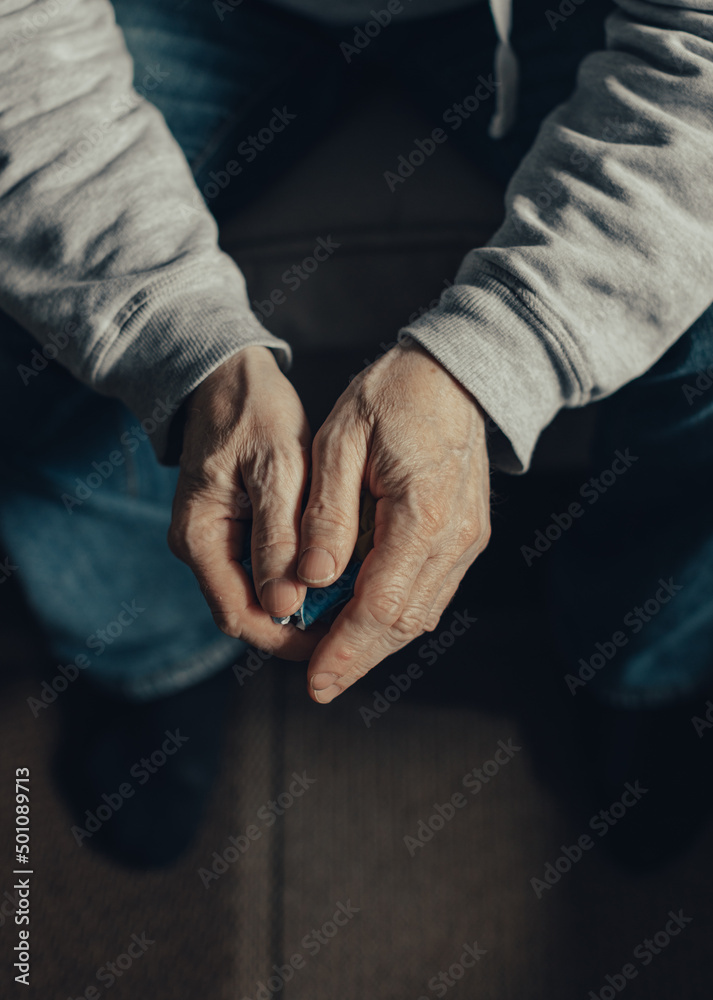 Crumpled flag of Ukraine in the hands of a middle aged man. Stop war. Crumpled flag of Ukraine in the hands of a middle aged man. Stop war.