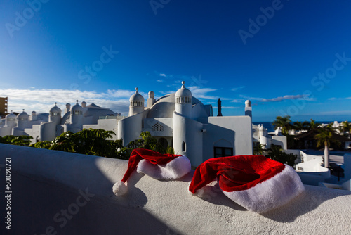 Fototapeta Naklejka Na Ścianę i Meble -  Santa hats on Christmas vacation in Greece