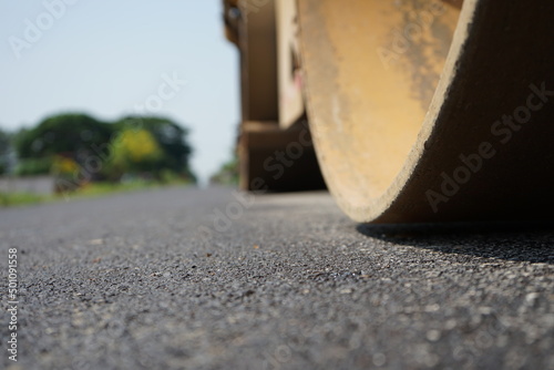 The image is blurred in the construction of asphalt road.