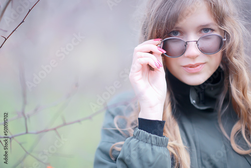 girl glasses autumn portrait, an adult woman glamorous autumn look
