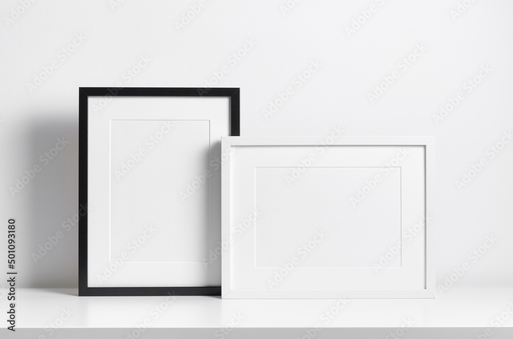 Black and white frames mockup in minimalistic room interior Black and white frames mockup in minimalistic room interior