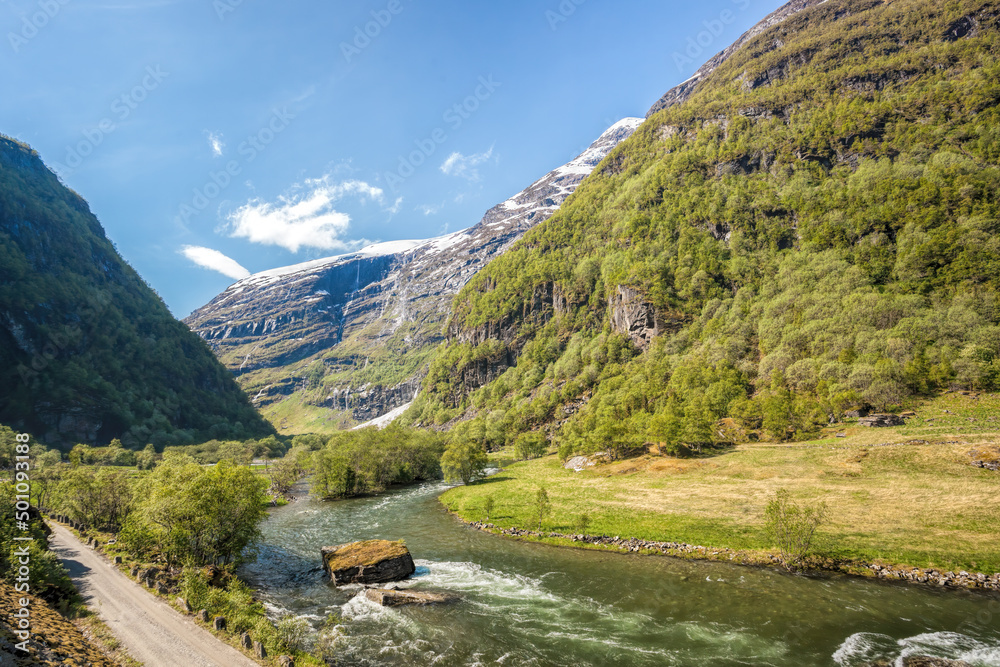 Deep valley with river of Norwegian fjords close the train journey Flamsbana between Flam and Myrdal in Aurland in Western Norway Deep valley with river of Norwegian fjords close the train journey Flamsbana between Flam and Myrdal in Aurland in Western Norway