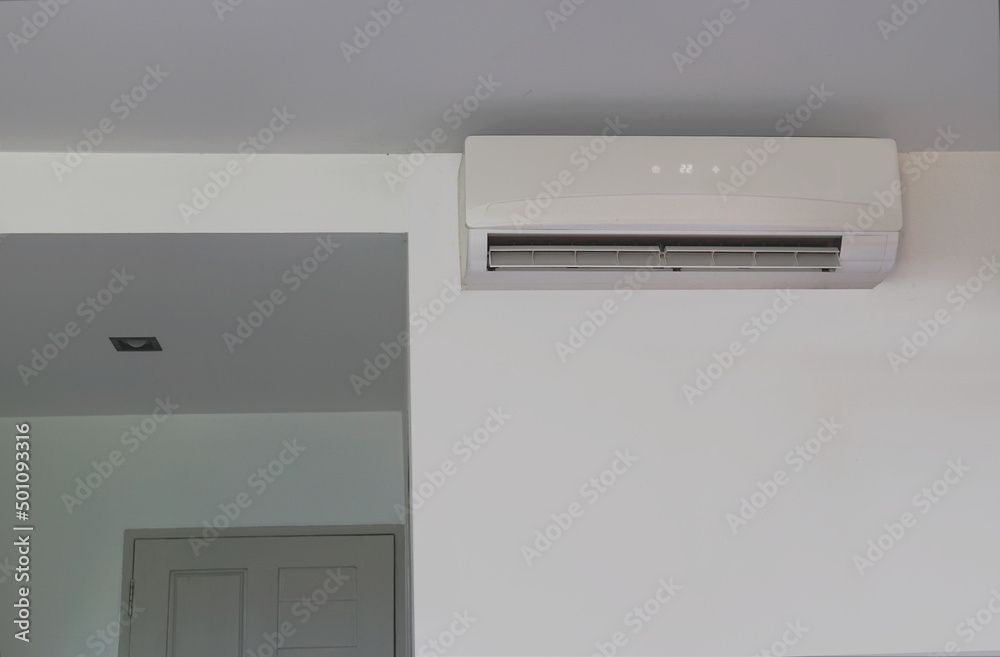 Wall mounted air conditioner that is installed in the bedroom. Wall mounted air conditioner that is installed in the bedroom.