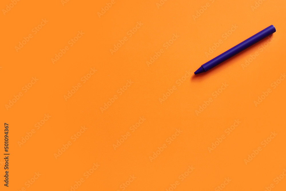 top view of purple crayon on bright orange background. - obrazy, fototapety, plakaty 