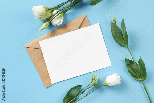 Card mockup with white eustoma and envelope. Wedding invitation with eustoma.