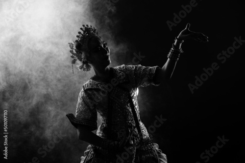 Half body of Asian Woman wear Thai Traditional Costume Dancer with beautiful design dress silhouette © Jade