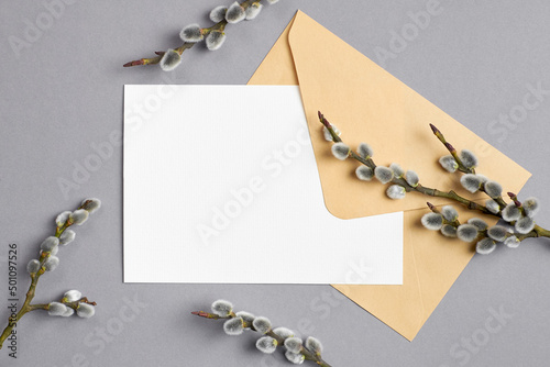 Fototapeta Invitation or greeting card mockup with envelope and willow twigs