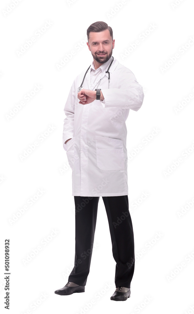 in full growth. medical doctor looking at his wrist watch in full growth. medical doctor looking at his wrist watch
