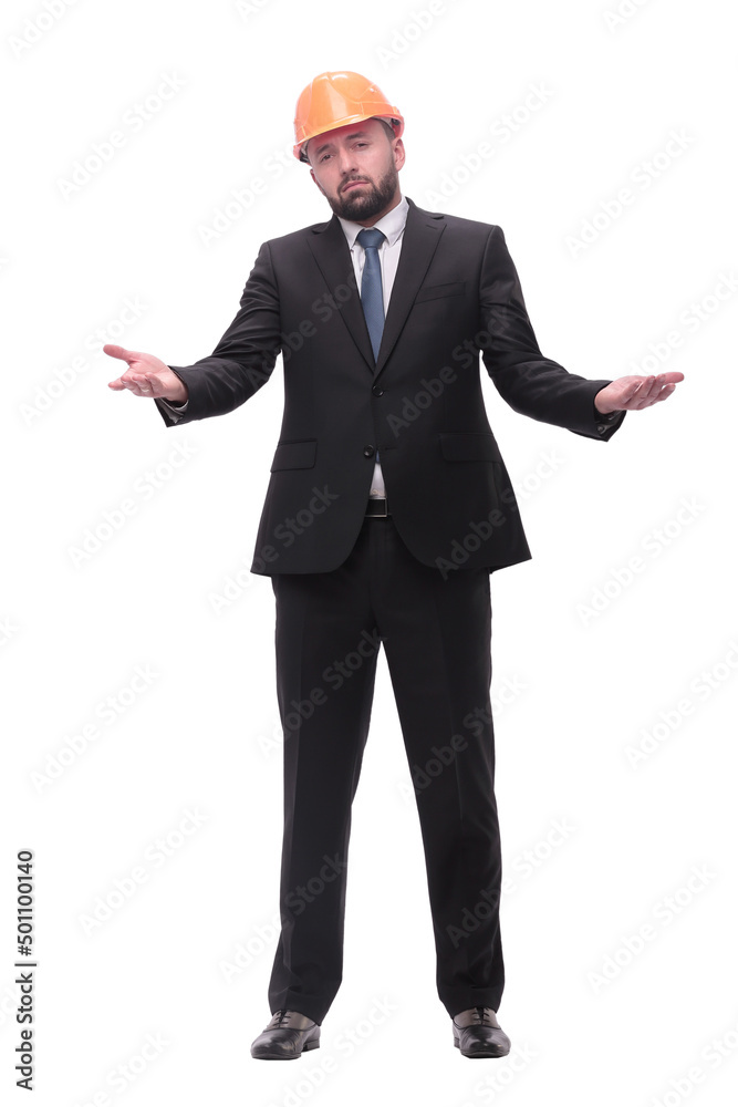 in full growth. young businessman in helmet looking far the upward in full growth. young businessman in helmet looking far the upward