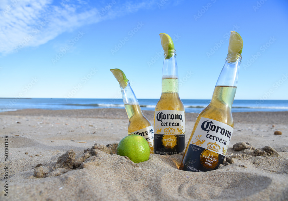 Corona Cerveza Beer Bottles on the beach near the sea. cold beer with