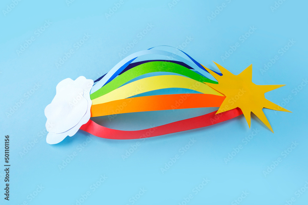 Obraz premium Colored Rainbow and white clouds from paper. DIY and kid's creativity. Children's DIY crafts to International world day of peace