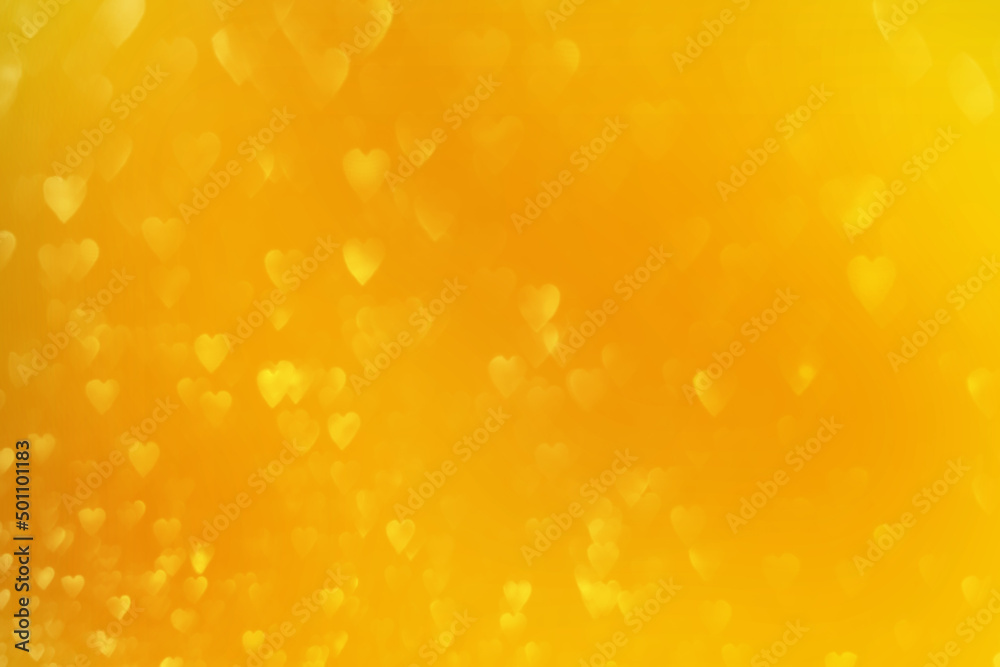 Bright yellow hearts, sparkling glitter bokeh background, abstract defocused texture