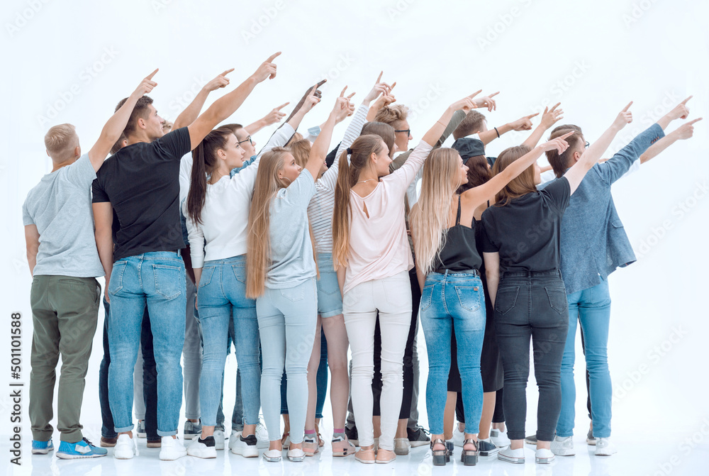Obraz premium rear view. group of young people pointing in one direction