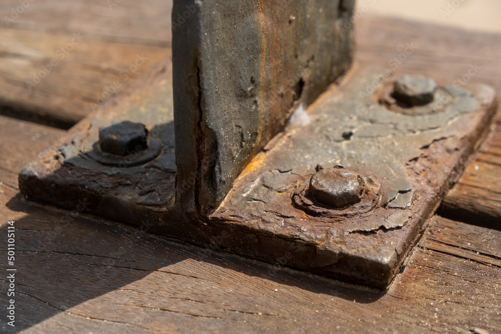 Corrosive rusty bolt close-up. Wood and metal are susceptible to rust. Corrosive rusty bolt close-up. Wood and metal are susceptible to rust.