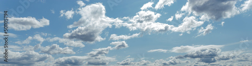 Background of light blue sky with white clouds at the bottom © bonilook