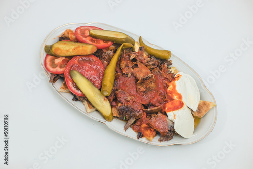 turkish national food iskender or iskender kebab with yogurt and herbs