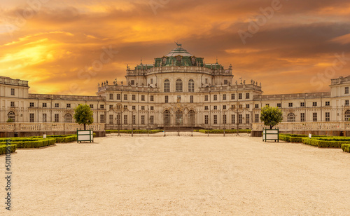 Stupinigi, Turin, Italy - May 16, 2020: Palazzina di Caccia historic royal hunting lodge of the Savoy royal house, colorful cloudy sunset sky