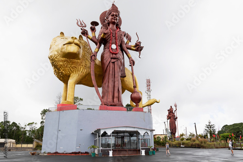 Statue of the Hindu goddess Durga, 108 feet tall, with her lion vehicle Manastala, at Ganga Talao, Mauritius, Indian Ocean