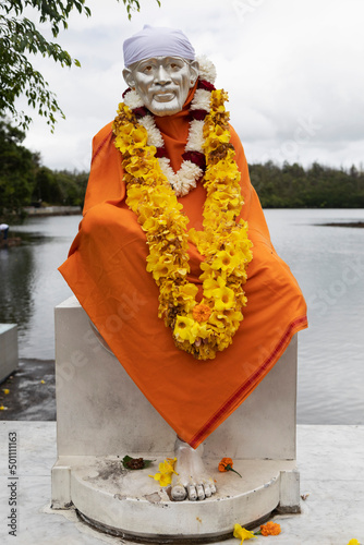 Statue of Sai Baba of Shirdi, the guru and fakir also known as Shirdi Sai Baba, at Ganga Talao, Mauritius, Indian Ocean photo