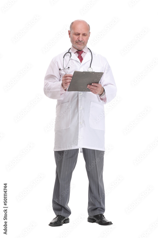 Front view of mature serious doctor writing on clipboard Front view of mature serious doctor writing on clipboard