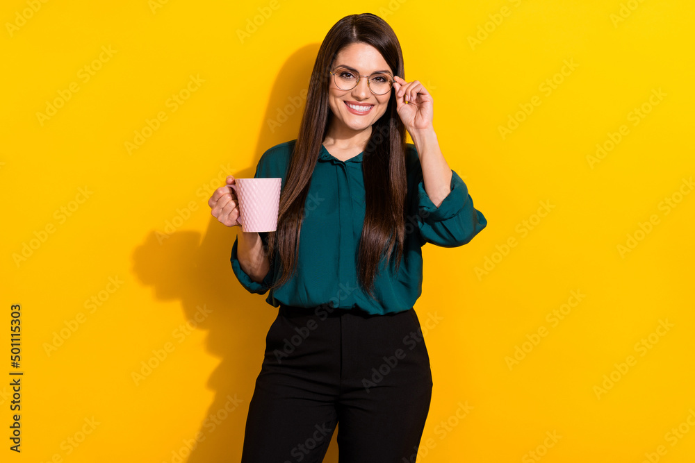 Photo of young lovely lady hand touch eyeglasses smart enjoy cappuccino isolated over yellow color background Photo of young lovely lady hand touch eyeglasses smart enjoy cappuccino isolated over yellow color background