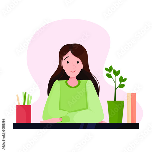 Woman at work in the office sitting at the table