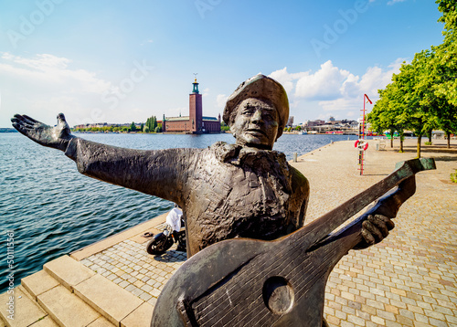 Evert Taube Statue with City Hall in the background, Stockholm, Stockholm County, Sweden photo