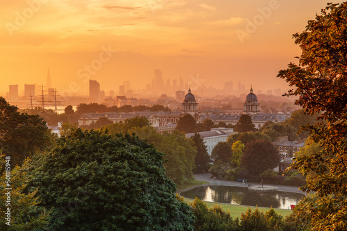 View of Greenwich Old Royal Naval College and London skyline at dusk, Greenwich, London photo