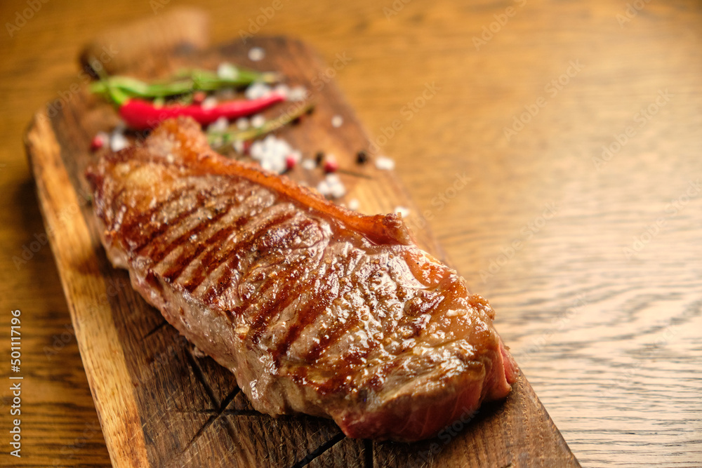 Grilled ribeye beef steak, herbs and spices Grilled ribeye beef steak, herbs and spices