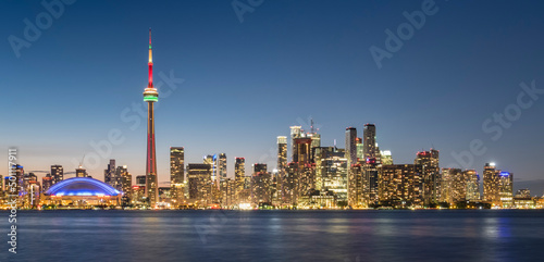 Toronto skyline featuring the CN Tower at night across Lake Ontario, Toronto, Ontario photo