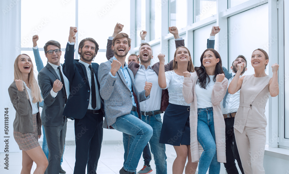 Fototapeta premium in full growth. a group of happy young business people