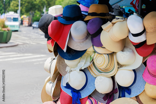 Beach hats selling on the city street.